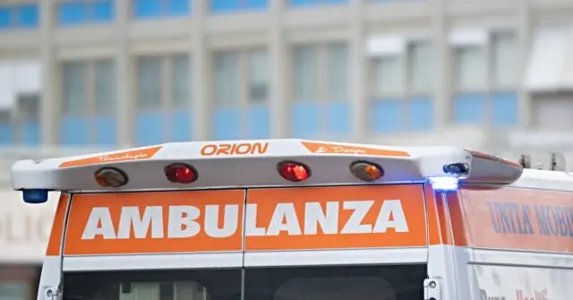 The image shows the rear of an Italian ambulance with the word "AMBULANZA" prominently displayed, indicating it is an emergency medical vehicle.
