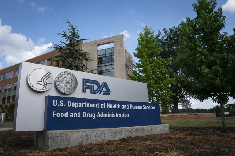 The image shows the sign for the U.S. Food and Drug Administration (FDA) in front of its headquarters.