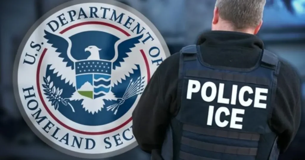 The image shows a law enforcement officer wearing a vest labeled "POLICE ICE" standing in front of the U.S. Department of Homeland Security seal.