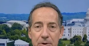 The news photo features a person speaking in front of a backdrop that includes the U.S. Capitol building and surrounding greenery.