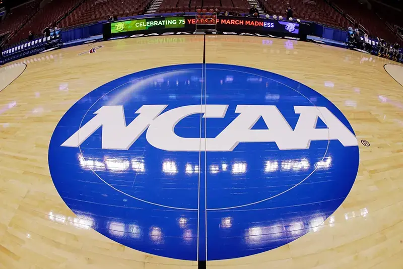 The image shows a basketball court with the NCAA logo prominently displayed, celebrating 75 years of March Madness.