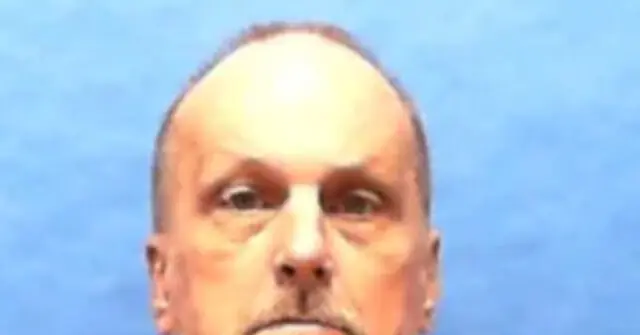 The image shows a close-up of a person's face against a blue background.