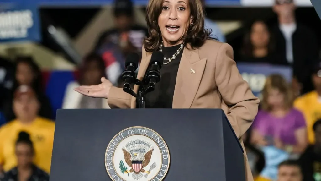A person stands at a podium with the seal of the President of the United States, addressing an audience.
