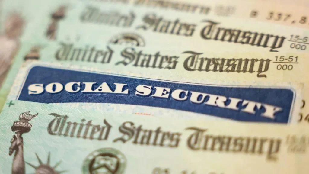 The image shows a close-up of a Social Security check from the United States Treasury.
