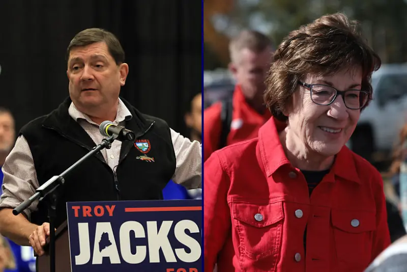 The image shows two individuals, one speaking at a podium with a "TROY JACKS FOR" sign and the other smiling in a red jacket, likely at a political event.