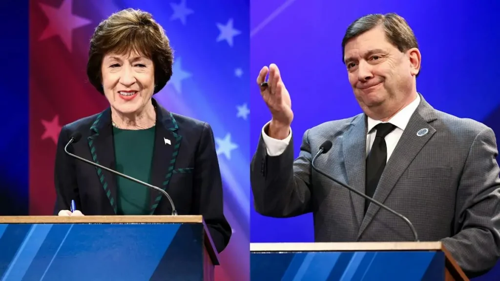 The image shows two individuals standing at podiums, likely participating in a political debate or discussion, with a backdrop featuring American flag elements.