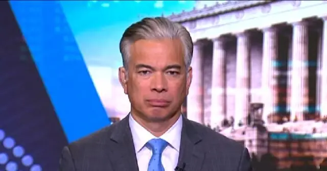 The news photo features a man in a suit and tie, set against a backdrop of a classical building with columns.