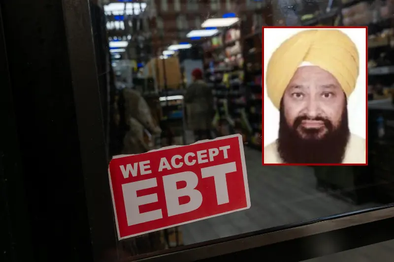 The image shows a sign on a store window stating "WE ACCEPT EBT," with a reflection of a person wearing a yellow turban in the window.