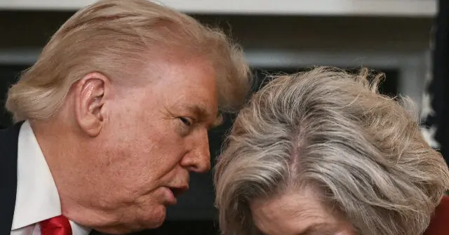 The image shows a close-up of two individuals, one with light-colored hair and the other with gray hair, appearing to be engaged in a conversation.