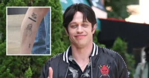 The image shows a person giving a thumbs-up gesture, with a close-up inset of a tattoo on their arm.