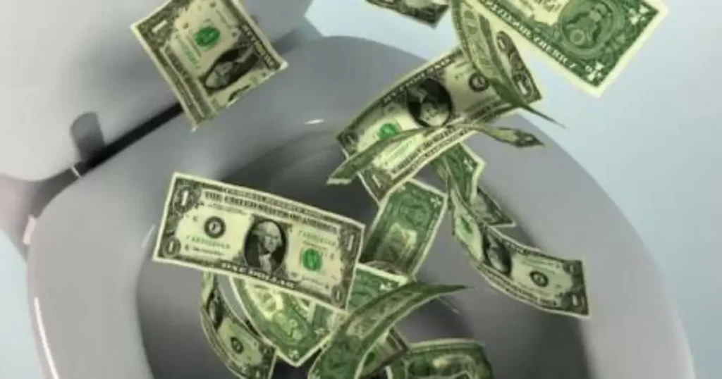 The image depicts a toilet with one-dollar bills falling into it, symbolizing the waste of money.