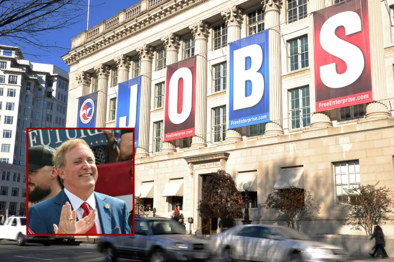 The image shows a large building with "JOBS" banners displayed on its facade, alongside a smaller inset photo of a man in a suit clapping.