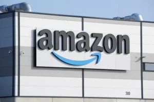 The image shows the Amazon logo prominently displayed on the exterior of a building.