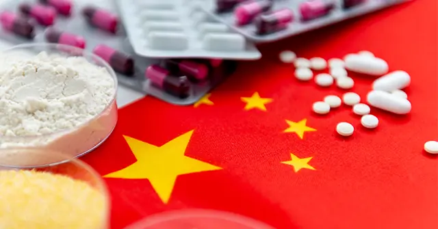 The image depicts a Chinese flag with various pharmaceutical products, including capsules and powders, suggesting a focus on the country's pharmaceutical industry or healthcare sector.