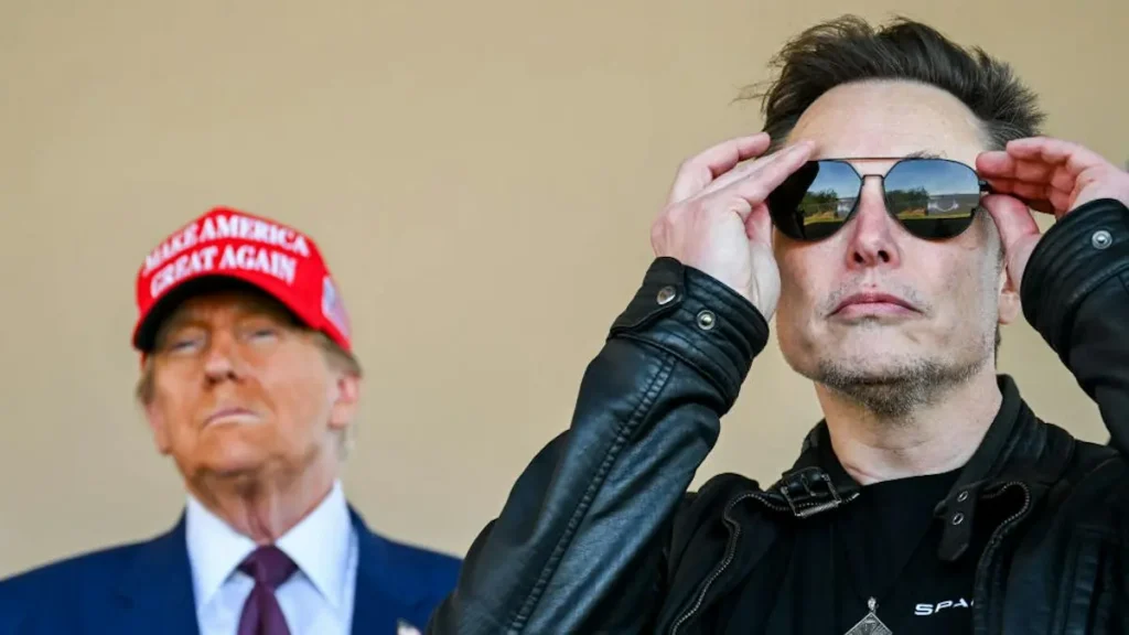 The image shows two individuals, one wearing a "Make America Great Again" hat and the other adjusting their sunglasses, both in a neutral setting.