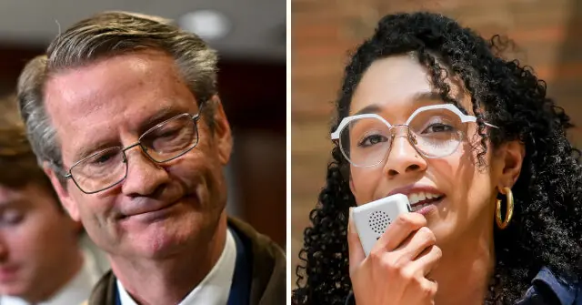 The image shows two individuals, one smiling and wearing glasses, and the other holding a microphone, suggesting a formal or professional setting.
