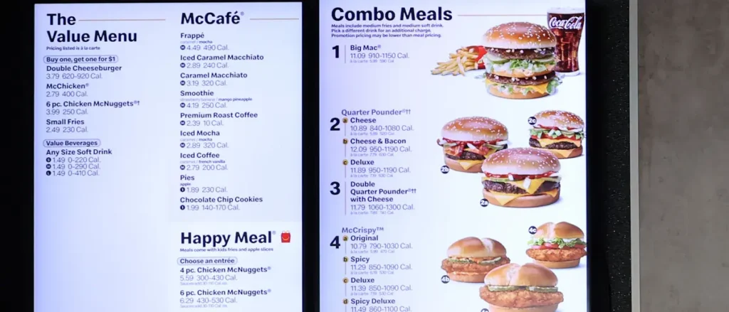 The image shows a McDonald's menu board displaying various meal options, including value menu items, McCafé beverages, and combo meals.