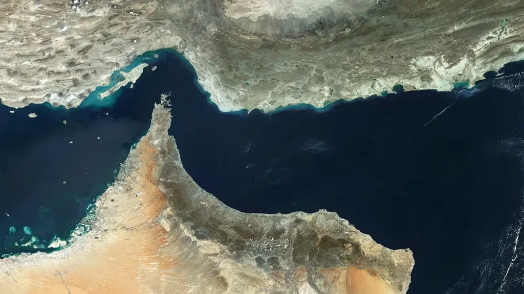 This satellite image shows the Arabian Peninsula, highlighting the Gulf of Oman and the Strait of Hormuz.
