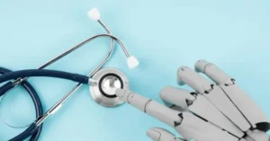 The image depicts a robotic hand interacting with a stethoscope, symbolizing the integration of technology in healthcare.