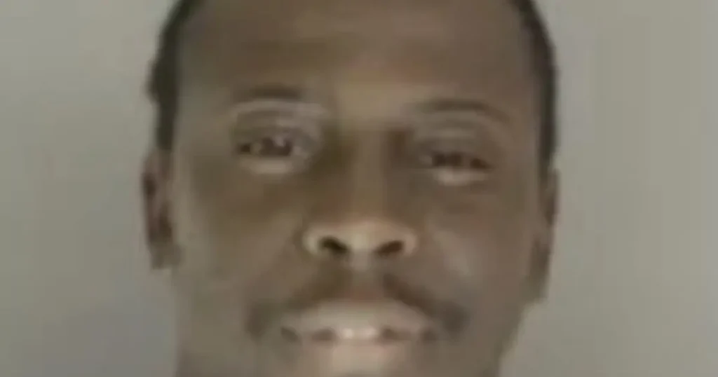 The image appears to be a close-up of a person's face, possibly for identification or news purposes.